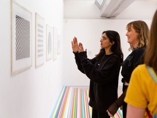 Young people discussing Bridget Riley at the Tate Liverpool