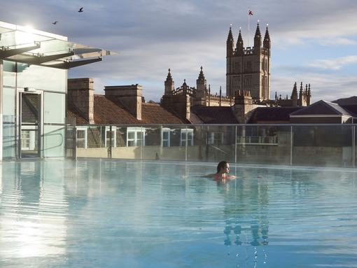 Woman swimming in a swimming pool at a spa