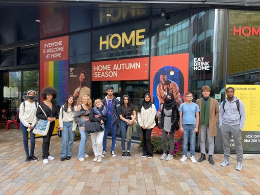 A group of people on a music themed tour of Manchester