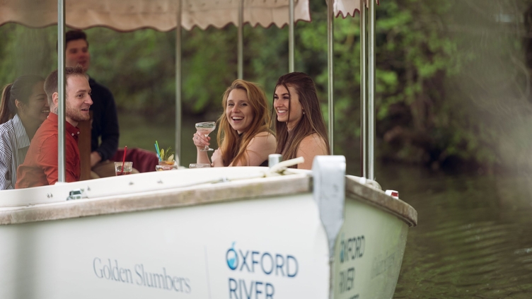 A group of people on a river boat in Oxford