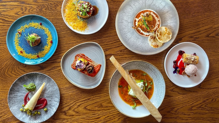 Various dishes served on a table at Prashad Restaurant in Leeds