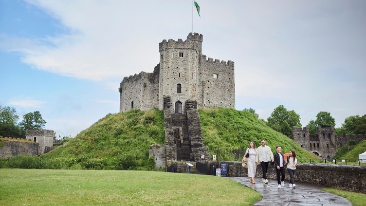 Family walking in front of Cardiff Castle