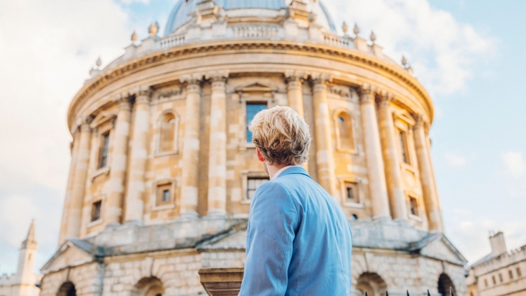 Man looking up at an historical building